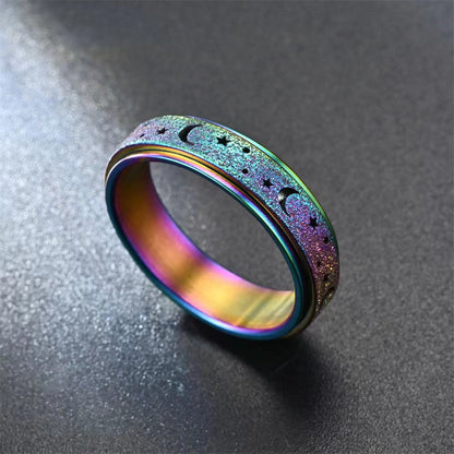 Bague anti stress Lunéria multicolore déposée sur table noir