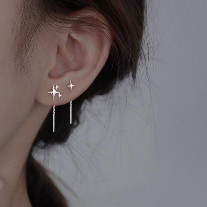 boucle d'oreille trois étoile à l'oreille gauche