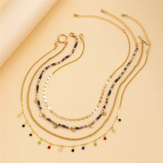 collier multicouche Niméra déposé en cercle ouvert